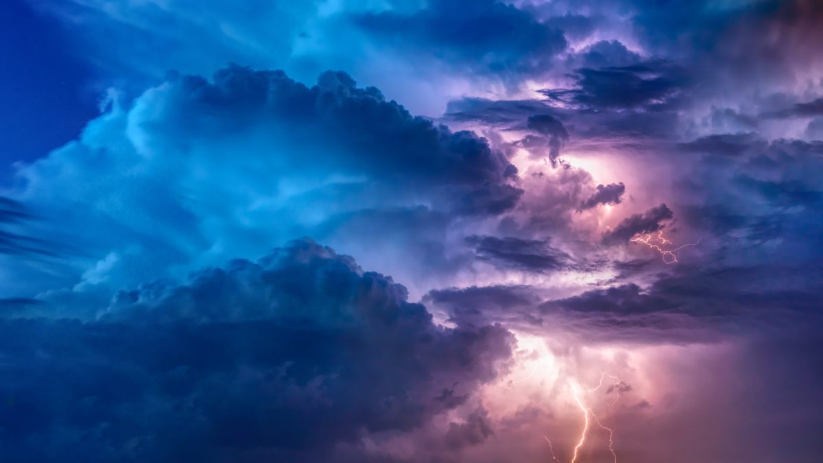 purple and blue clouds with lightening