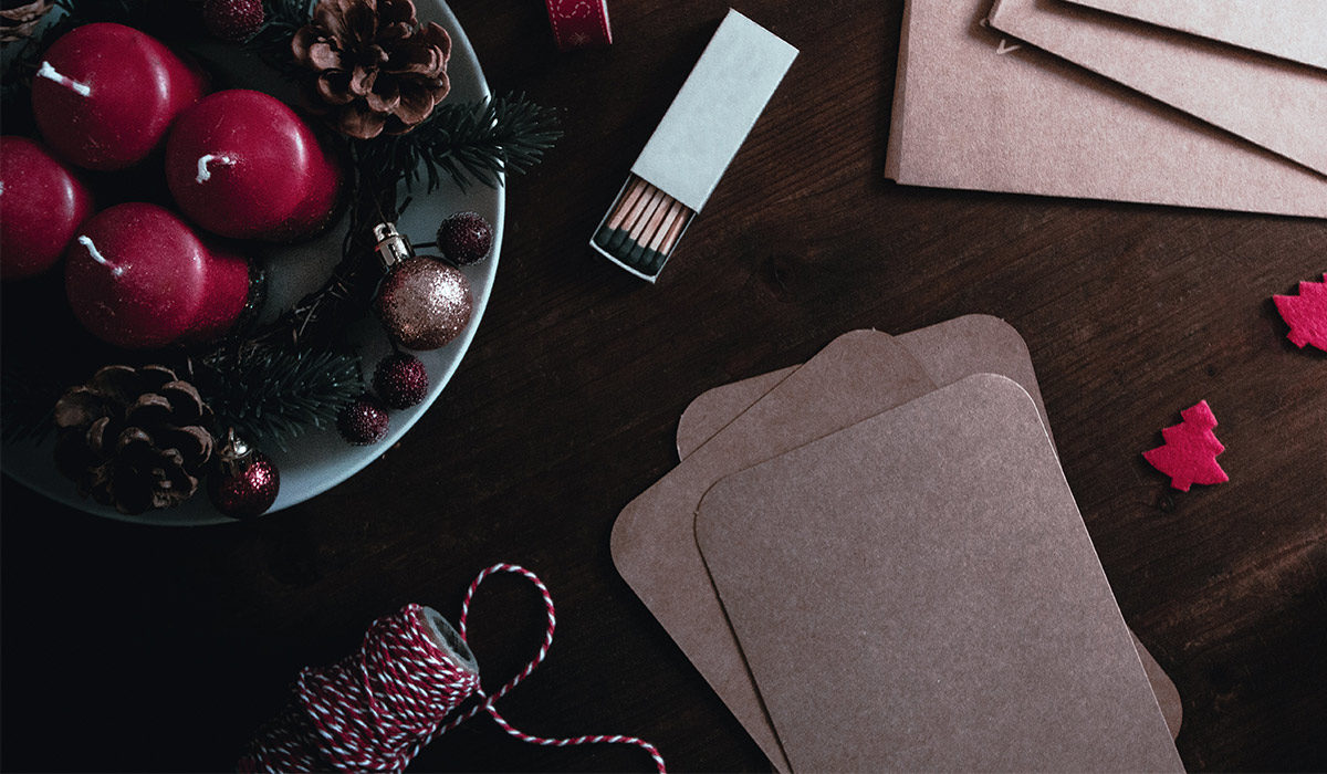 various christmas decorations including a box of matches and red string
